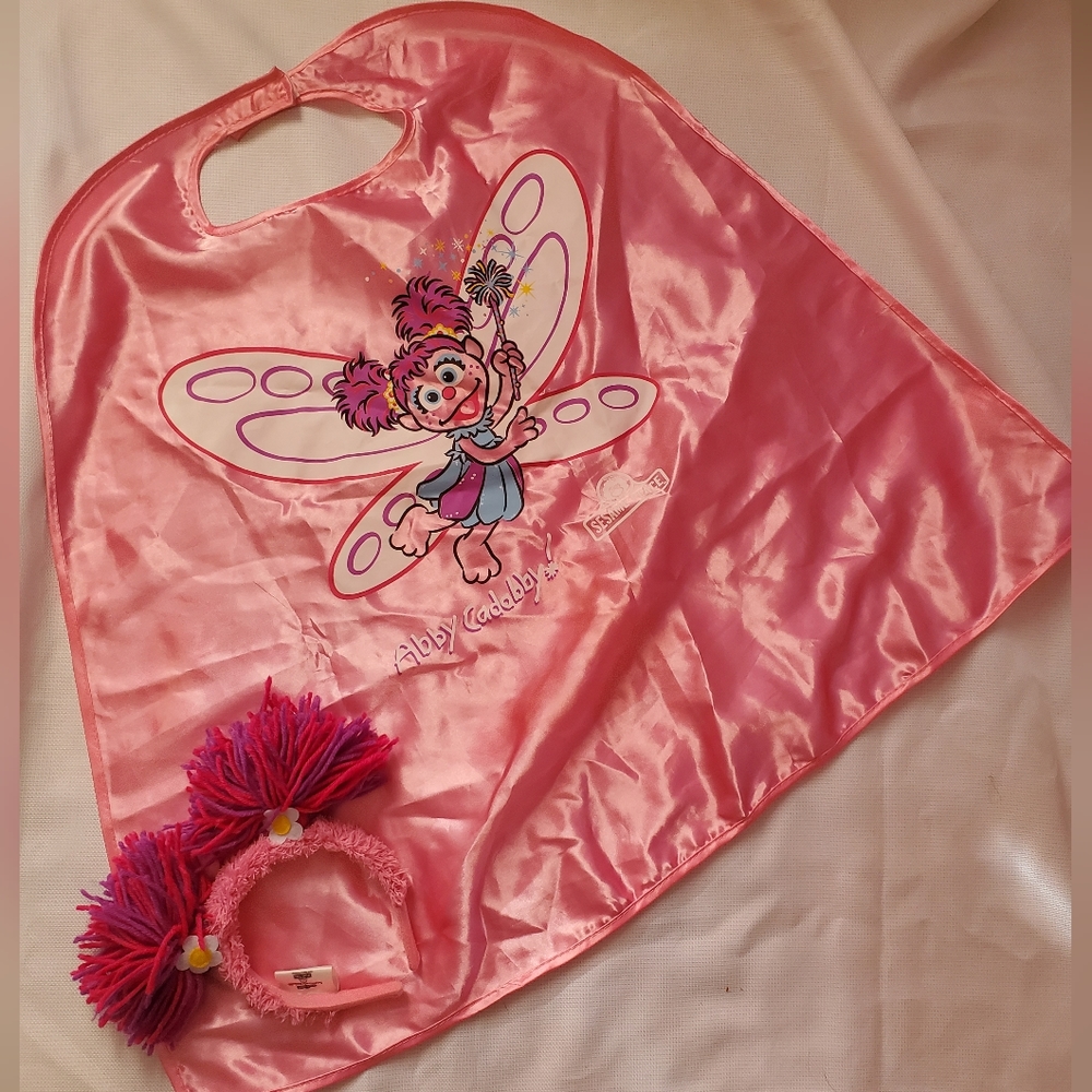 Abby Caddaby cape and headband from sesame place . Official park merchandise